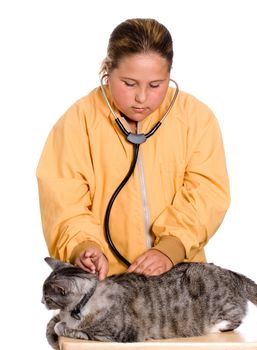 A preteen girl is checking the heart rate of her pet cat, isolated against a white background