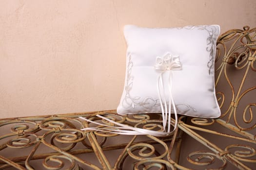 Ring Pillow on an old style rustic seat