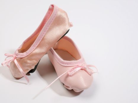 One Leather and one satin ballet shoe