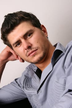 Male model in studio against white wall