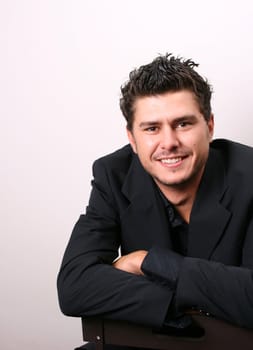 Male model in studio against white wall