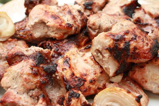 Shish kebab - shashlik - caucasian kitchen. Meat on skewers fried on coals.