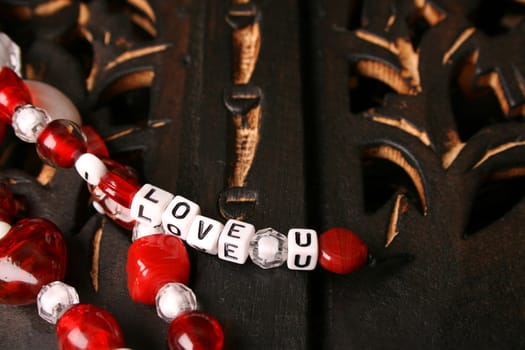 Red and white valentines beads with letters