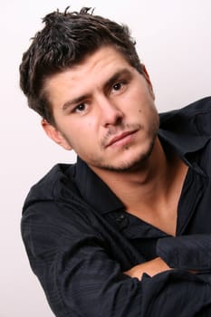 Male model in studio against white wall