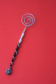 Hand Made Quill spoons on a red background

