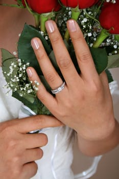 Bride holding a red rose bridal bouquet