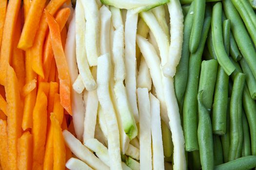 Background of julienne vegetables:  green beans, baby marrows and carrots