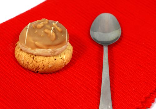 muffin with spoon on red napkin