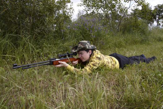 Young hunter shooting up