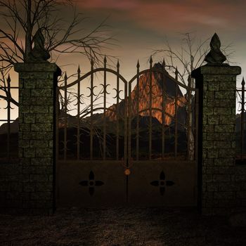 A locked gate with the mountains behind it at sunset