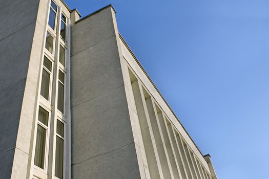 Detail of industrial and office building on a background of blue clear sky