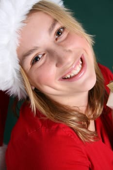 Christmas teen wearing a red hat with a big smile