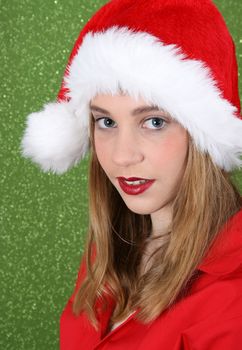 Teenager with red lips wearing a christmas hat