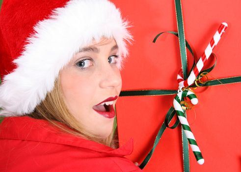 Teenager with red lips wearing a christmas hat