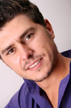 Male model in studio against white wall