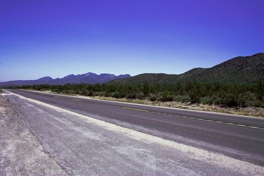 Empty romantic road among the hills