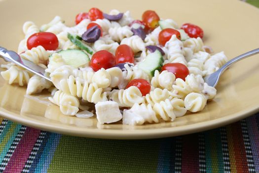 Cold Pasta Salad with tomatoes, cucumbers and olives