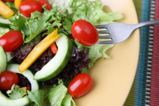 Fresh colorful salad with cherrie tamatoes and cucumber
