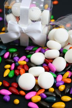 PVC Box decorated with ribbons, containing sweets