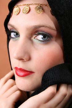 Female model with blue eyes wearing traditional folk dress
