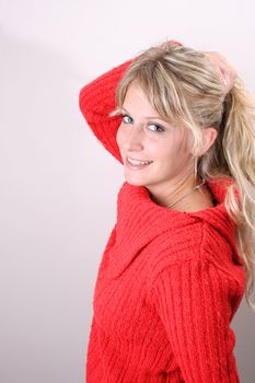 Blond Female model on a white background wearing a blue top