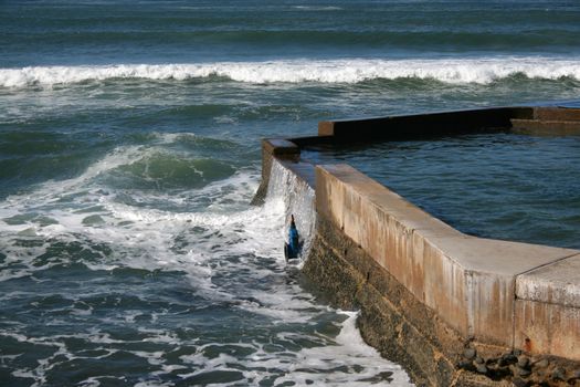 Swimming Pool connceted to the ocean at high tide