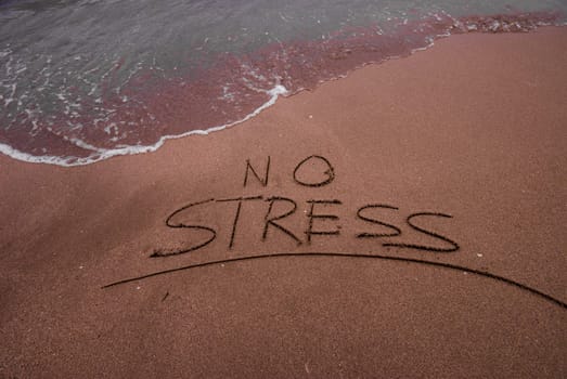 No stress inscription in sand on the beach