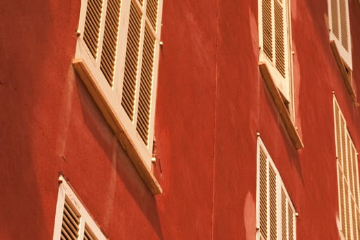 White windows in red facade