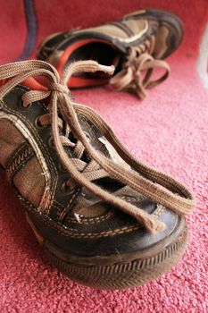 Beautiful old sport shoes of a little boy