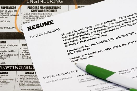 Jobs in the newspaper concept - with resume and a  classified ads.