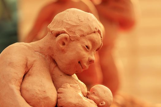 Mother and child clay figure found at nami island in korea.