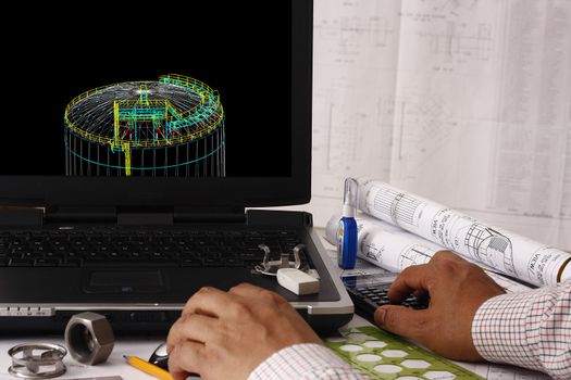 Engineer doing a 3d model review in his tank design - many uses in oil & gas industry.