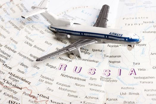 Travel to Moscow concept - with toy plane in russian map.