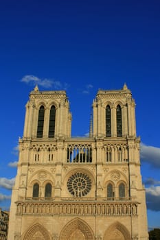 Notre Dame Cathedral, Paris France. Set on a deep blue sky at sunset.