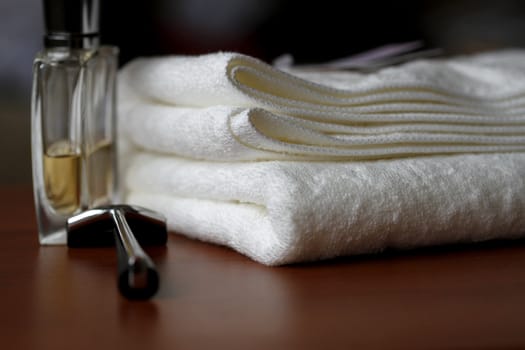 Perfume and Towel - preparation for taking a bath.