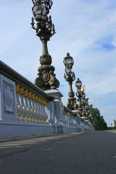Pont Alexandre II bridge in Paris France. Low angled view across bridge.
