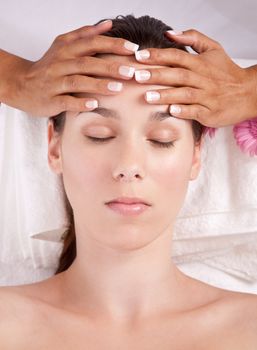 Beautiful woman in the beauty salon getting a facial massage