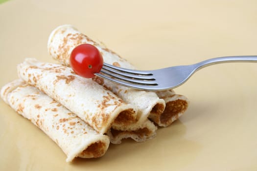 Close up of pancakes on a yellow plate