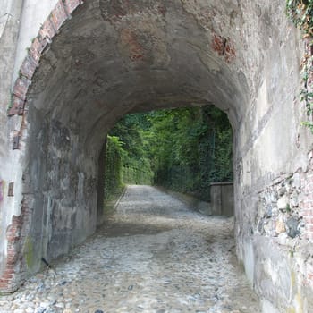 Perspective view of a tunnel with green park background