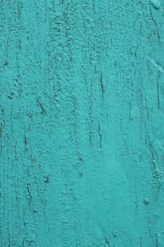 Old wooden surface painted in bright aquamarine