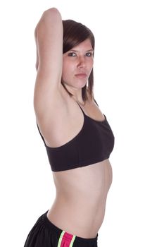 A girl is stretching her arms before she lifts some weights.