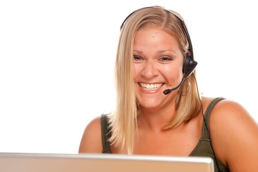 Attractive businesswoman smiles as she talks on her phone headset.