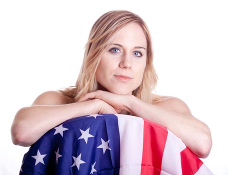 A cute girl poses with an American Flag