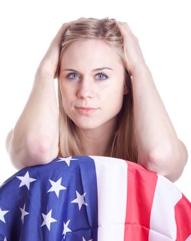 A hot girl pushes her hair back and poses with an American flag.