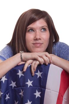 A cute girl poses with the American Flag