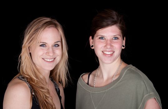 A photograph of two girls smiling for the camera.