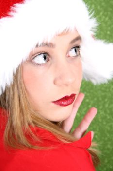 Teenager with red lips wearing a christmas hat