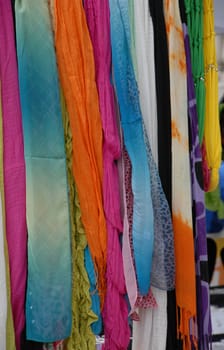 colorful scarfs for sale at a local street market