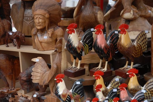 Wood carvings for sale at an outdoor market