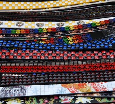 Colorful belts for sale at a street market